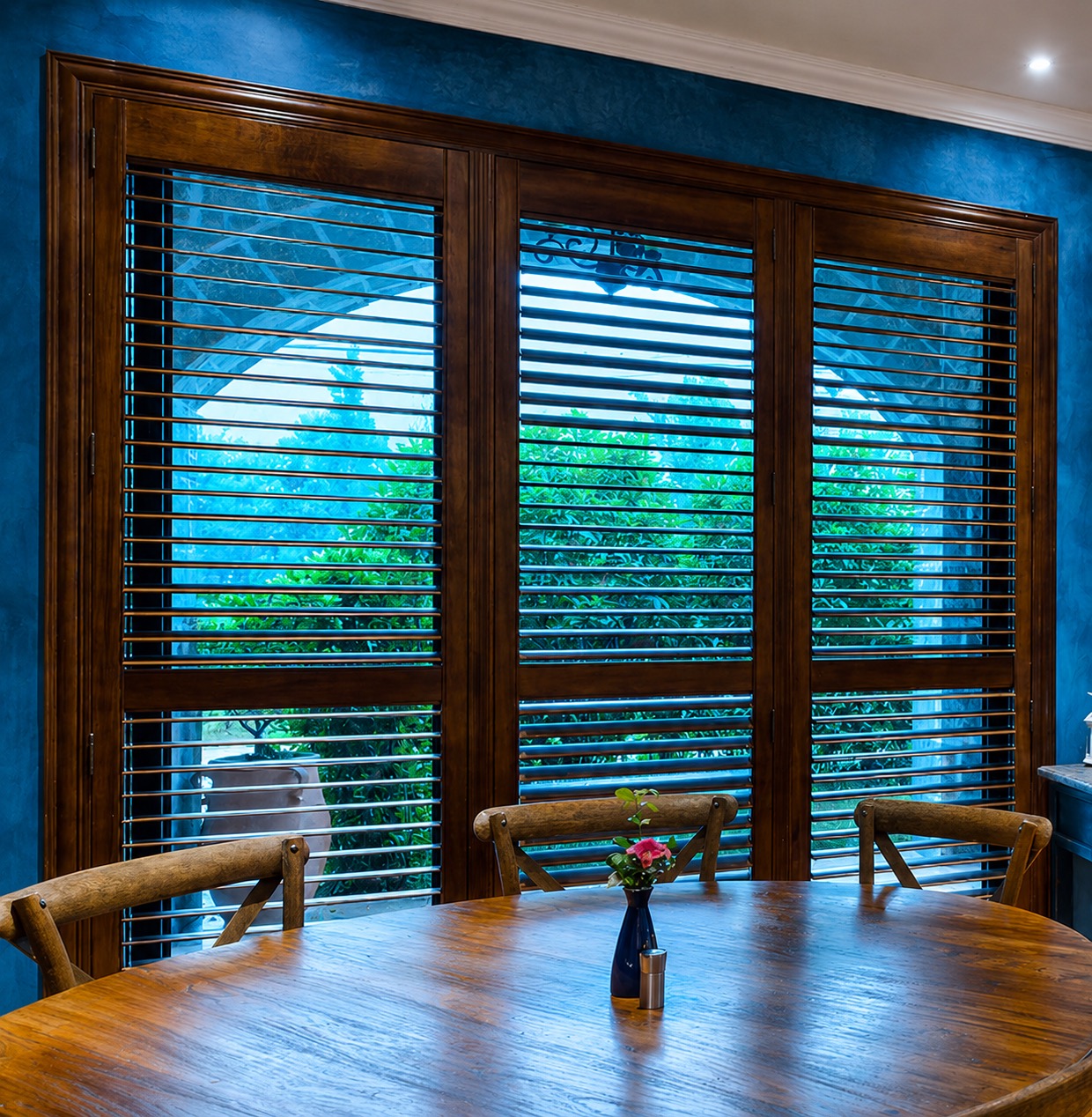 Dark wood plantation shutters in a refined residential interior